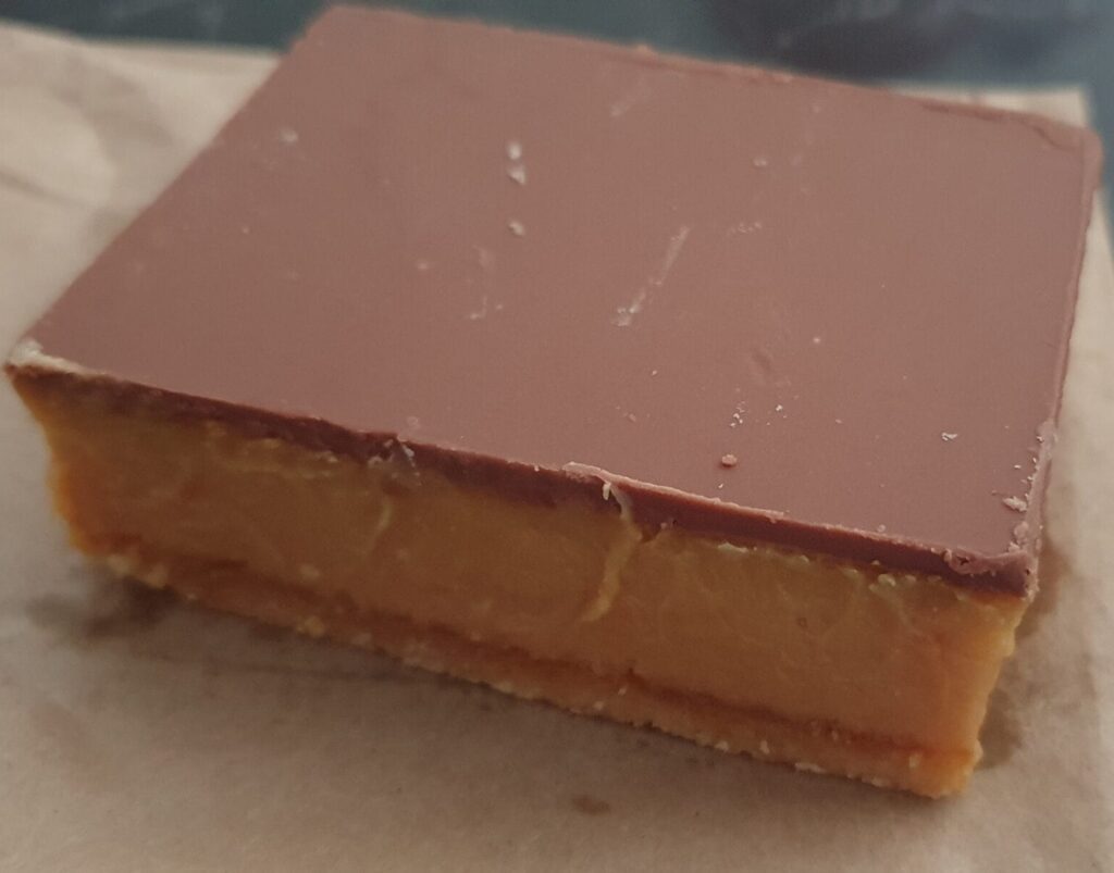 This biscuit base, and dense caramel topping with an equally thin chocolate top, this slice is all about the caramel!