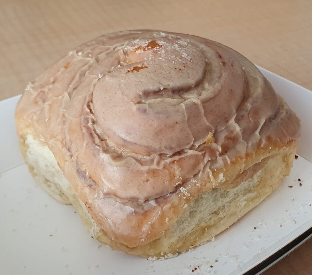 Cinnamon roll - known elsewhere as a cinnamon swirl or bun, and sometimes with dried fruit, this is the Aussie version - fluffy enriched sweet dough with a cinnamon, sugar, and butter filling. Baked until golden brown and served coated in cream cheese icing.